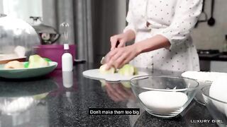 An American pie scene with Luxury Girl, showcasing her stunning 36D curves in the kitchen