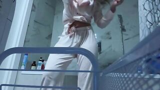 A little girl caresses her wet pussy in the bathroom, no one sees it