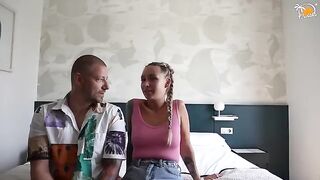 A couple enjoying their first time together in a hotel room, diving into dirty talk