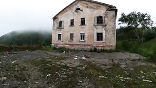 An exhibitionist girl is walking around a horrible building with her sexy bbe
