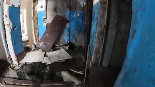 An exhibitionist girl is walking around a horrible building with her sexy bbe