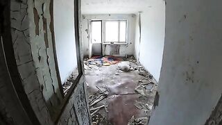 An exhibitionist girl is walking around a horrible building with her sexy bbe