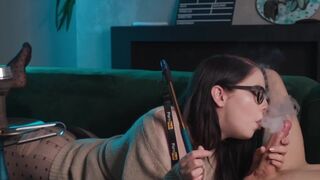 Nerdy girl in glasses smokes and sucks cock while getting fucked
