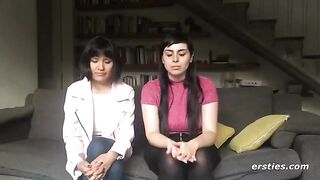 Two hot lesbian friends are having fun with a strapon dildo