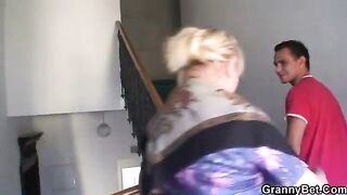 Old freckled granny with big tits enjoys riding cock of young guy