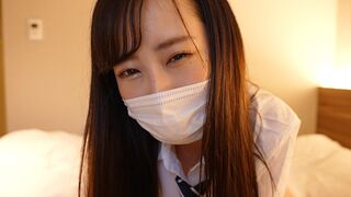 A Japanese girl wearing a sailor suit gives the guy a handjob