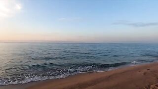 A girl is fucking on the beach and gets caught by a couple