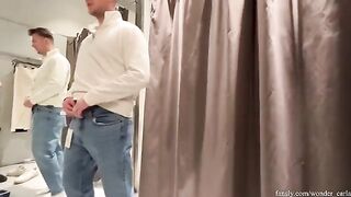 A hot chick was caught having sex in the fitting room of a store