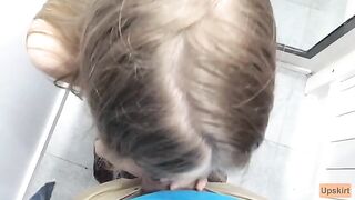 Public blowjob with a petite girl in a shop changing room, caught on camera