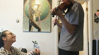 Passionate violin practice interrupted by eager girlfriend
