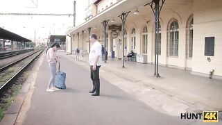 A cute girl is fucking with a guy for money on the train station
