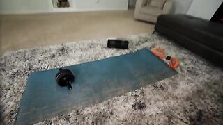 The cute brunette receives a large parcel from the mailman and gets excited