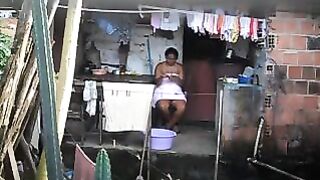 A black girl did not know that there was a secret camera in the room