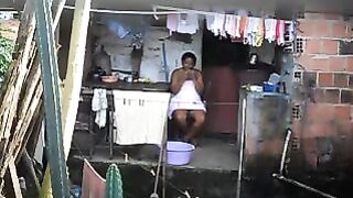 A black girl did not know that there was a secret camera in the room