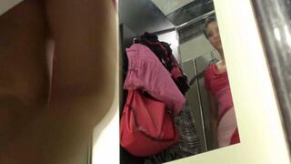 A peeping guy filmed a girl in the locker room of the store