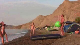 A badminton game with a naked twist on the beach