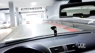 A hot girl is getting fucked while the guy is driving a car