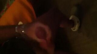 The guy masturbates in front of the mirror with passion