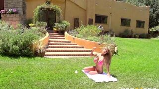 A hot blonde has sex right on the grass lawn