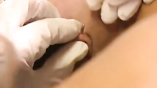 Babe with a clit piercing plays with her new sex toy