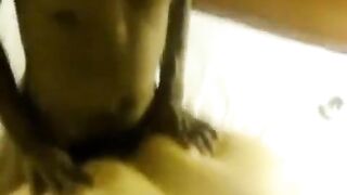 A fat woman with a big ass lays down on a man's dick