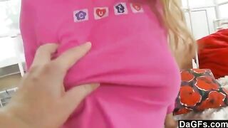A sweet young blonde plays with her panties and a dildo on the bed