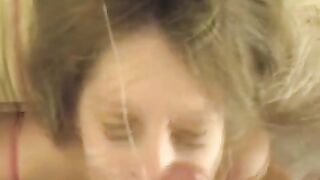A cumshot on the girl's face after a blowjob