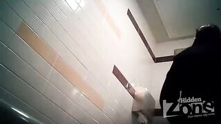 The camera is secretly set up in the woman's toilet. She undresses