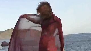 A sexy girl with small boobs has sex on the wet sand