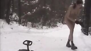 Nude girls throw snowballs at each other in the winter on the street