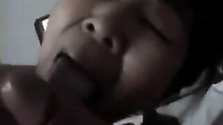 A Chinese woman practices her blowjob skills on him in bed