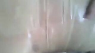 Condom on the cock, jerking off with his hand