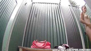 A girl washes in the shower and suddenly a camera appears