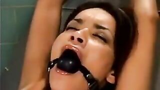 Girl was fucked by a bald man using a sex machine in a rough BDSM session
