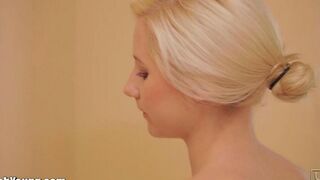 Hot woman plays with a brush in the bathroom