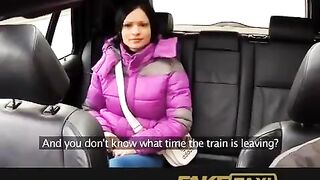 A hot girl is having fun with her taxi driver in his car