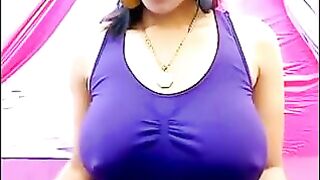 The nipples of a young girl are standing out through her T-shirt