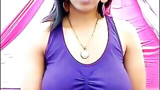 The nipples of a young girl are standing out through her T-shirt