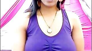 The nipples of a young girl are standing out through her T-shirt