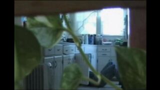 A married couple has fun while walking around their apartment naked