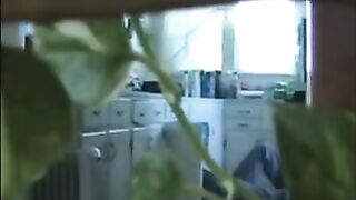 A married couple has fun while walking around their apartment naked