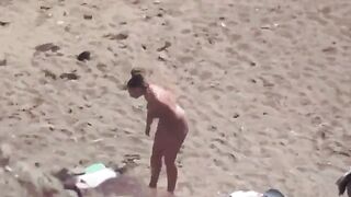 A pair of naturists have fun on the ship in the sea
