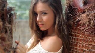 A pretty Russian girl takes off her clothes to show her body