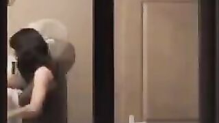 The guy looks at himself in the mirror, not dressed