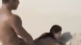 A beautiful chick is fucking on the naked beach