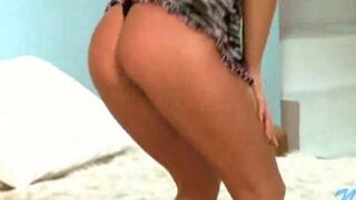 A young Russian whore demonstrates her stripping skills in a video