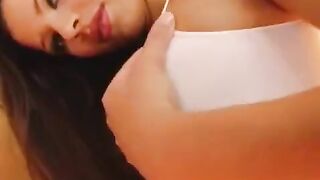 The girl plays with her big pussy with a strong dildo in close-up view