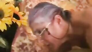 A man fucked a woman in black stockings with gray hair