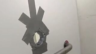 A guy checked the holes of girls in the club toilet