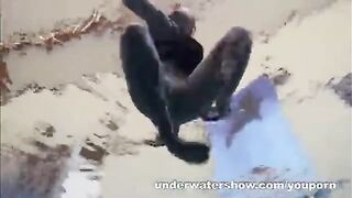 A sexy girl is floating naked in the pool. It's very erotic!
